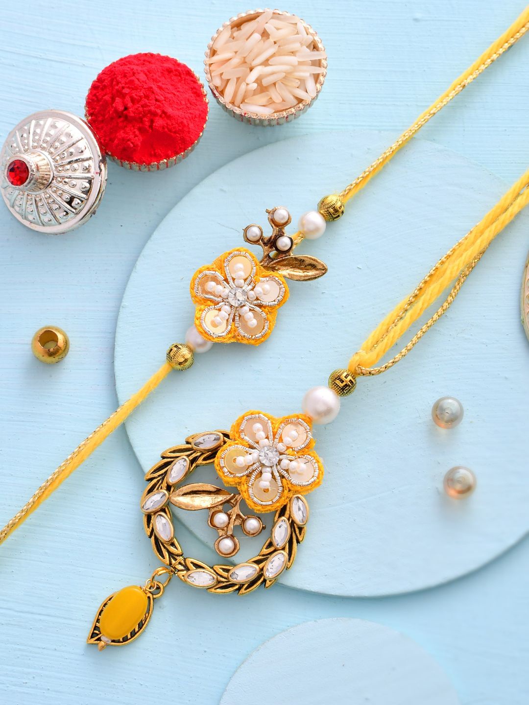 

Sangria Yellow Set of 2 Kundan & Beads Lumbs & Thread Rakhi With Roli Chawal