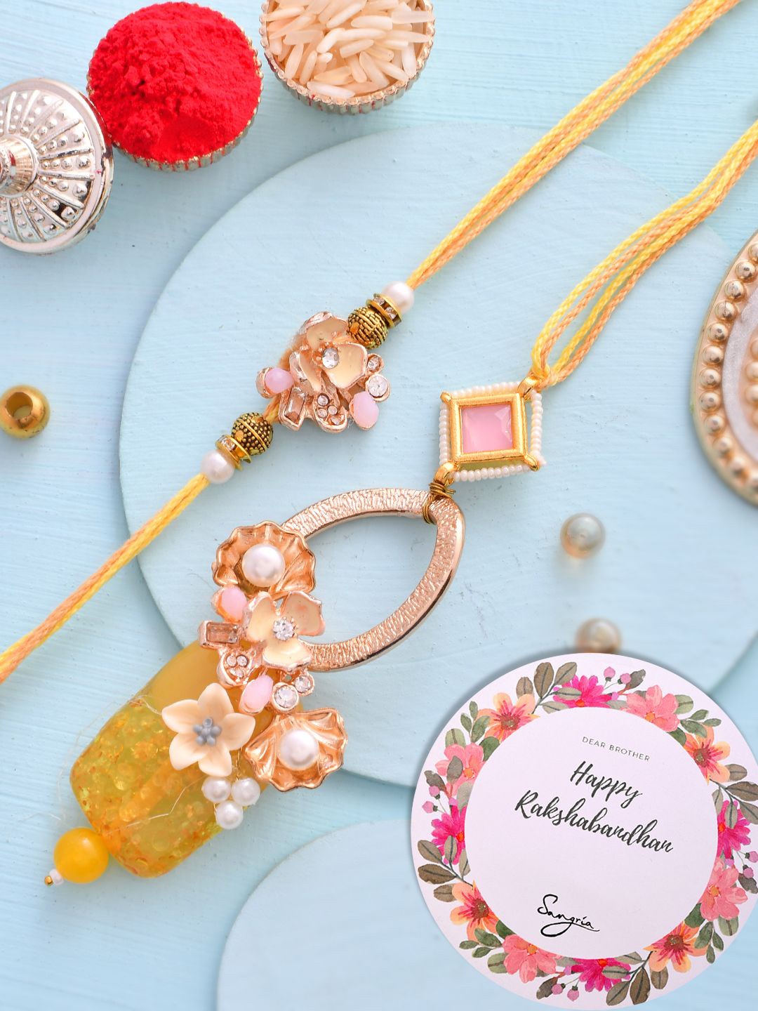 

Sangria Gold-Toned Set of 2 Pearl Beaded Lumbs & Thread Rakhi With Roli Chawal
