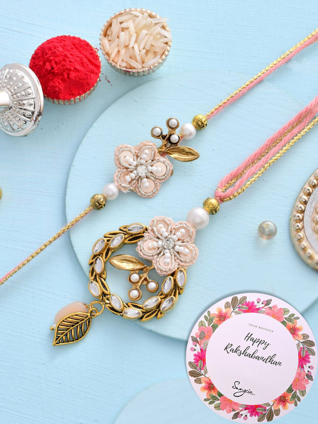 

Sangria Kundan & Beaded Embellished Bhaiya Bhabhi Rakhi With Greeting Card & Roli Chawal, Pink