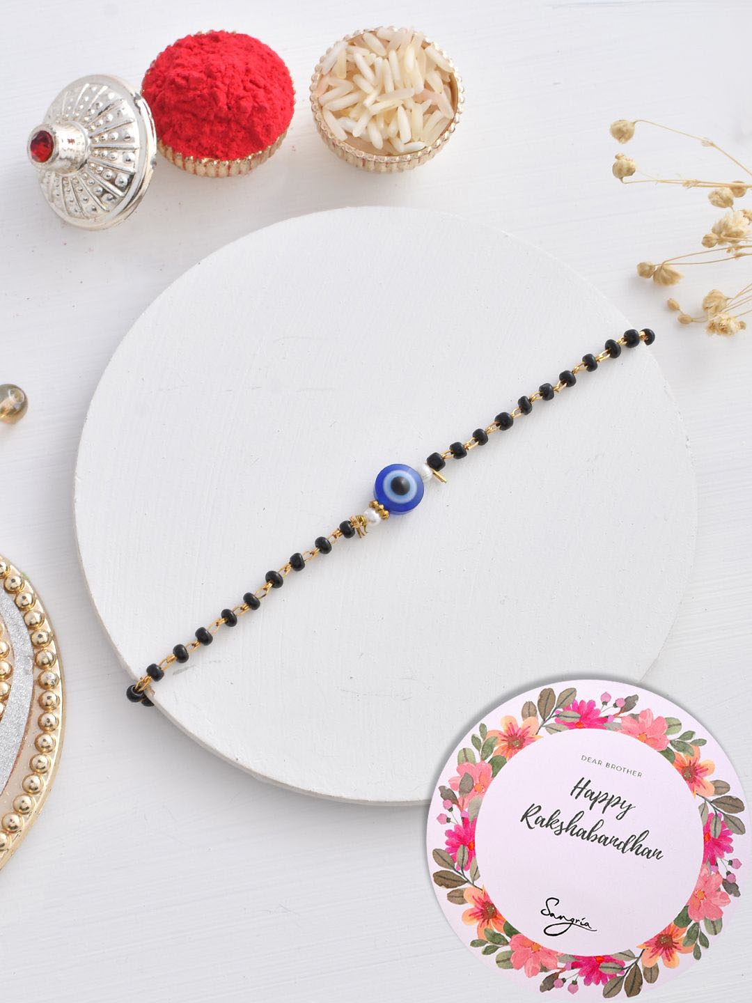 

Sangria Beaded Evil-Eye Rakhi With Greeting Card & Roli Chawal, Gold