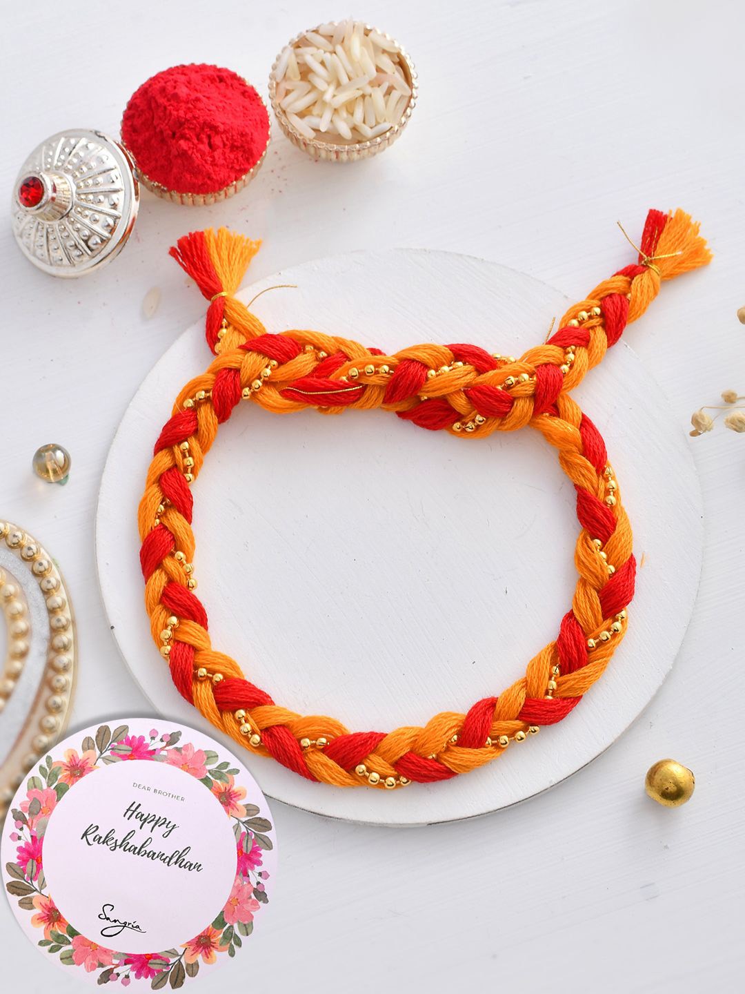 

Sangria Ghungroo Braided Thread Rakhi With Greeting Card & Roli Chawal, Gold