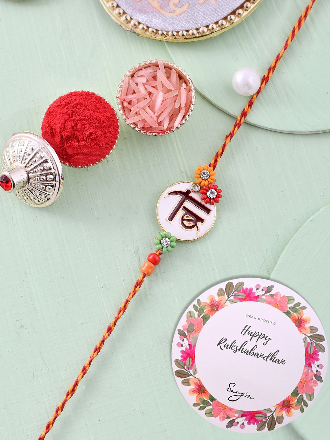 

Sangria Bro Embellished Simple Floral Rakhi With Greeting Card & Roli Chawal, White