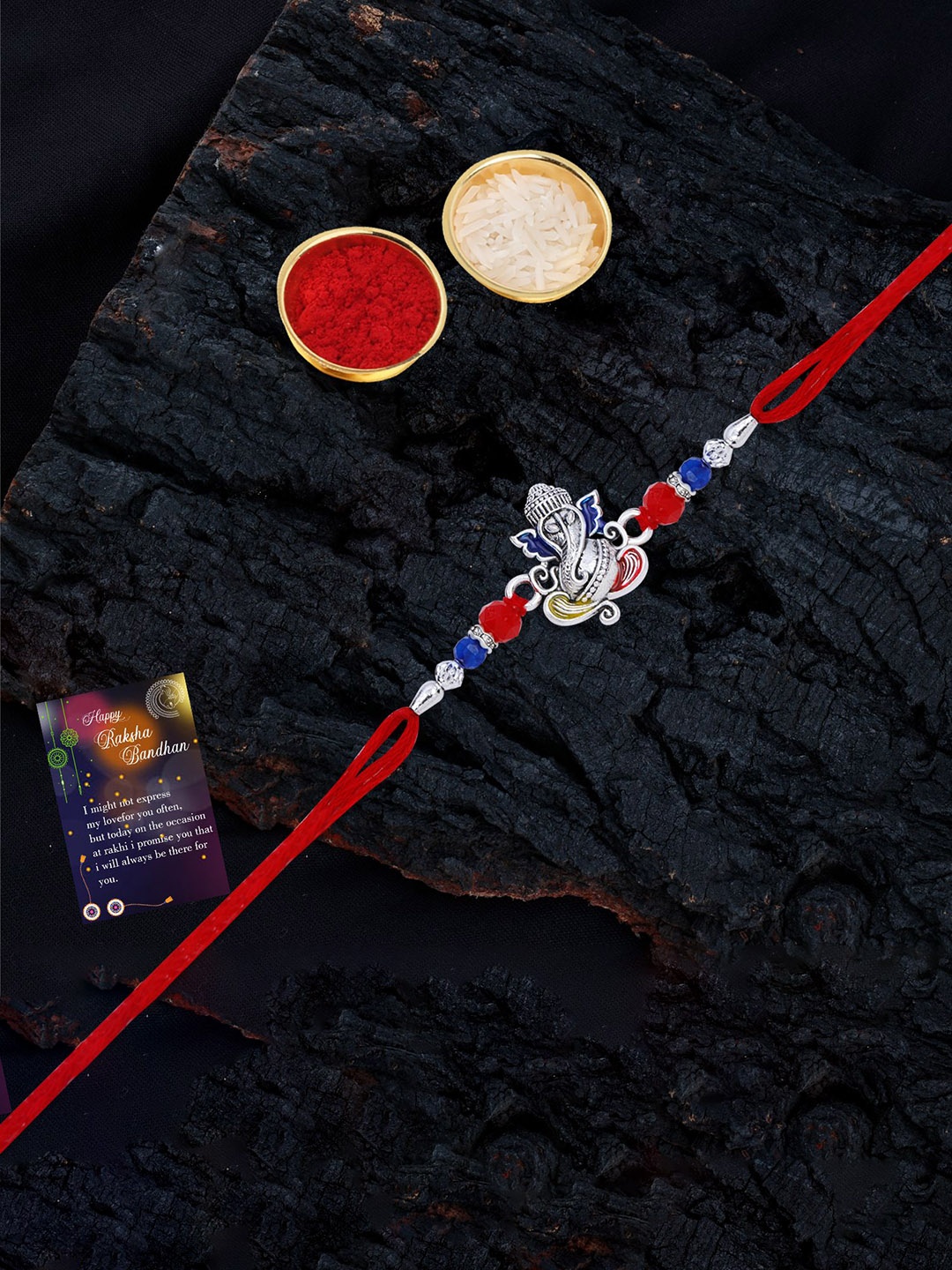 

Silver Shine Set Of 2 Beaded and Ganesha Thread Rakhis with Greeting Card & Roli Chawal, Gold