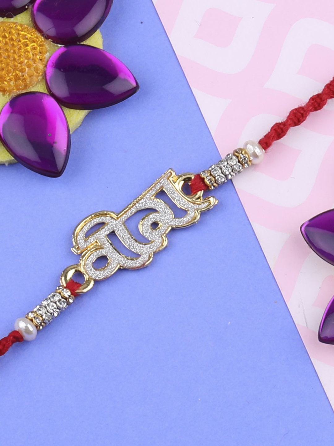 

Silver Shine Set Of 2 Beaded and Ganesha Thread Rakhis with Greeting Card & Roli Chawal