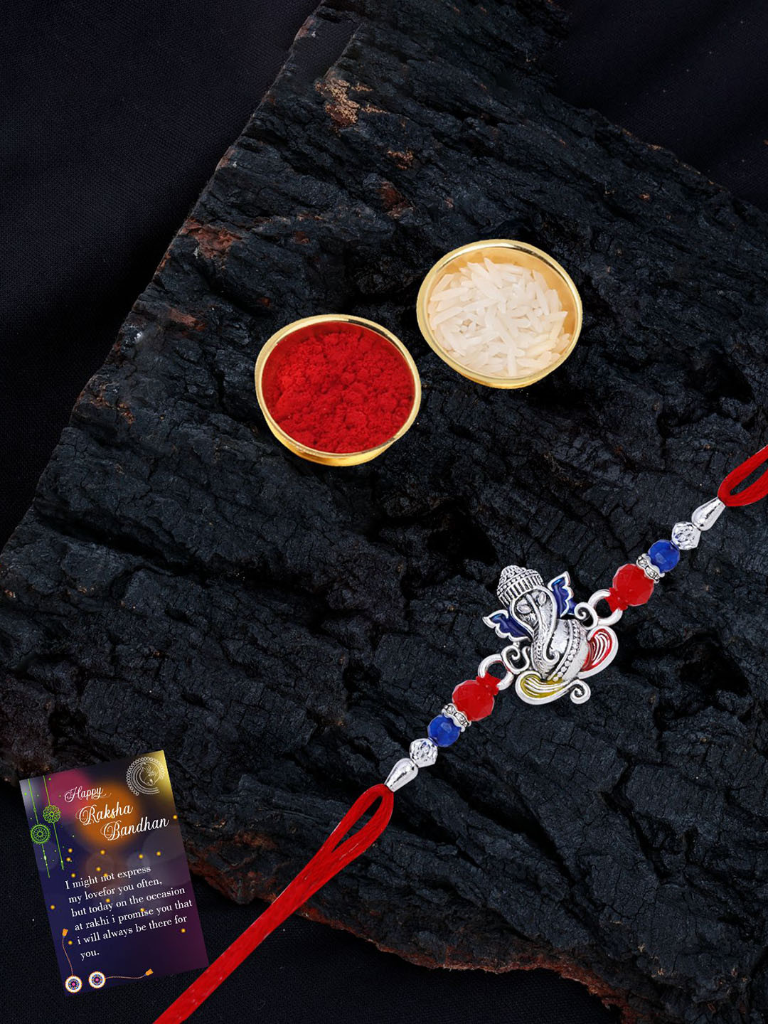 

Silver Shine Set Of 2 Beaded and Ganesha Thread Rakhis with Greeting Card & Roli Chawal