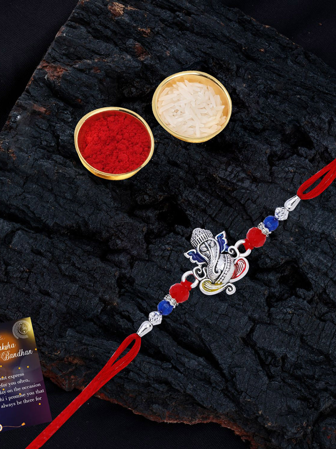 

Silver Shine Set Of 2 Beaded and Ganesha Thread Rakhis with Greeting Card & Roli Chawal