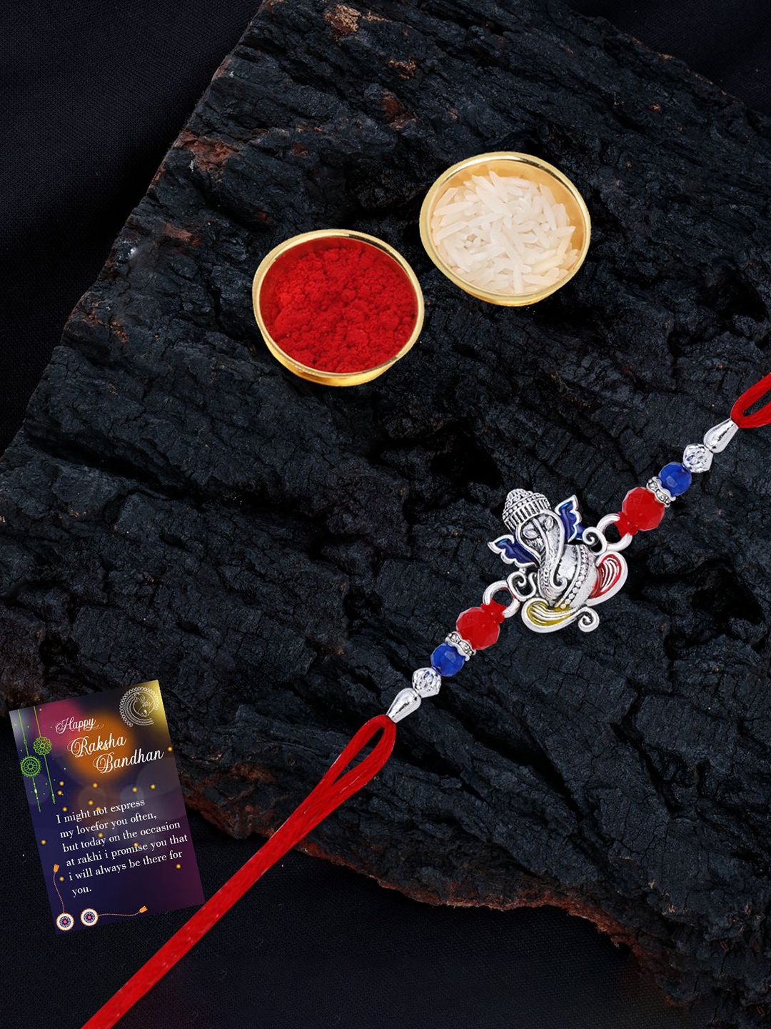 

Silver Shine Set Of 2 Beaded and Ganesha Thread Rakhis with Greeting Card & Roli Chawal