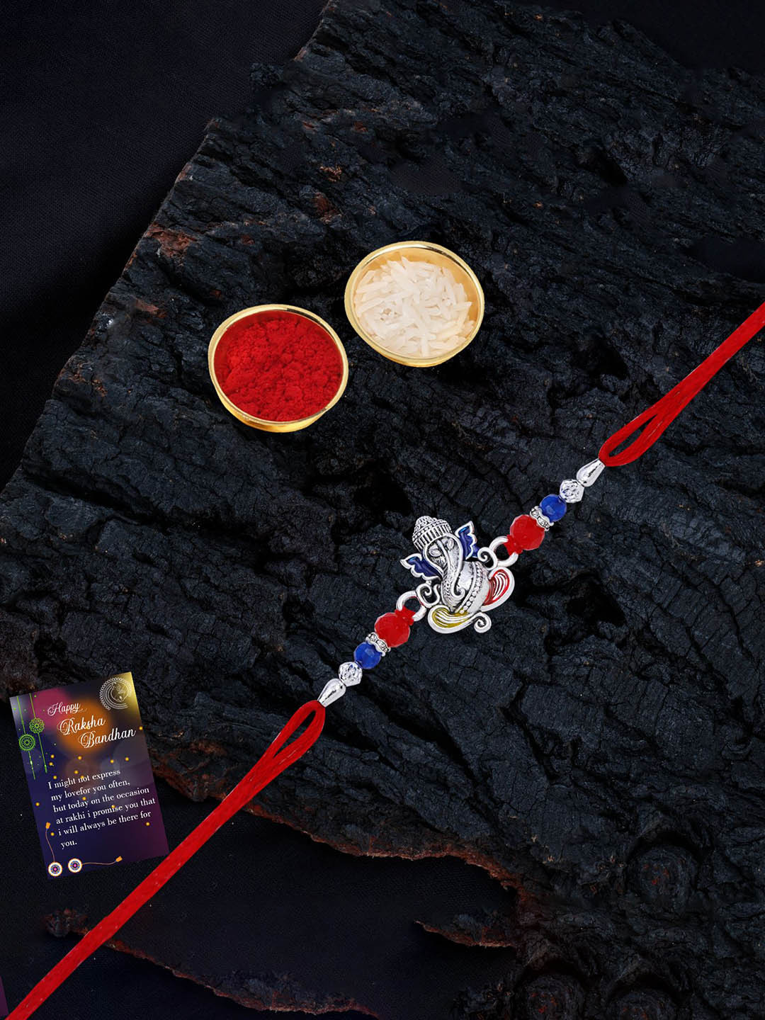 

Silver Shine Set Of 2 Beaded and Ganesha Thread Rakhis with Greeting Card & Roli Chawal