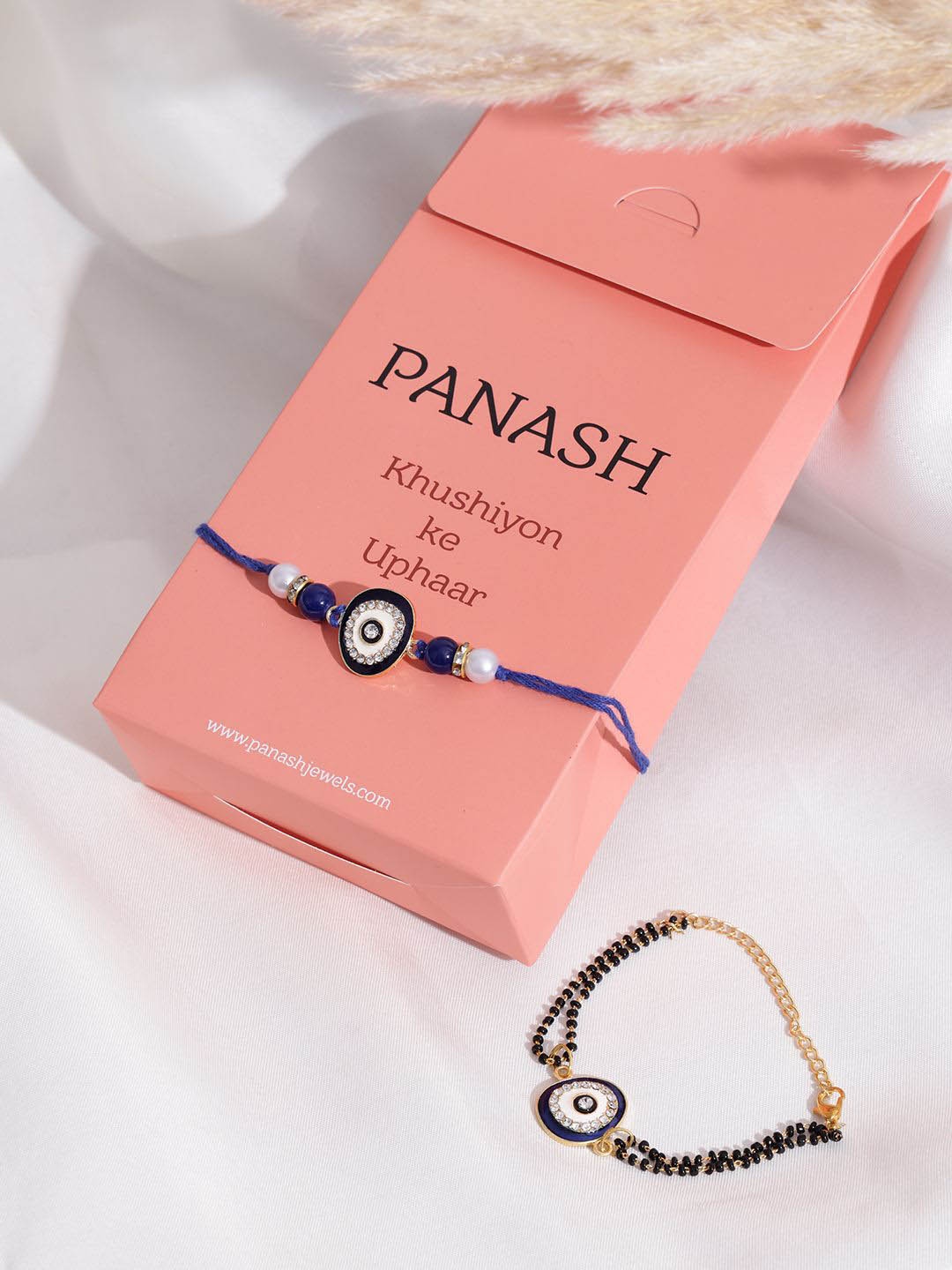 

PANASH Set of 2 Gold Plated Evil Eye Beaded Wraparound & Thread Rakhis With Roli Chawal