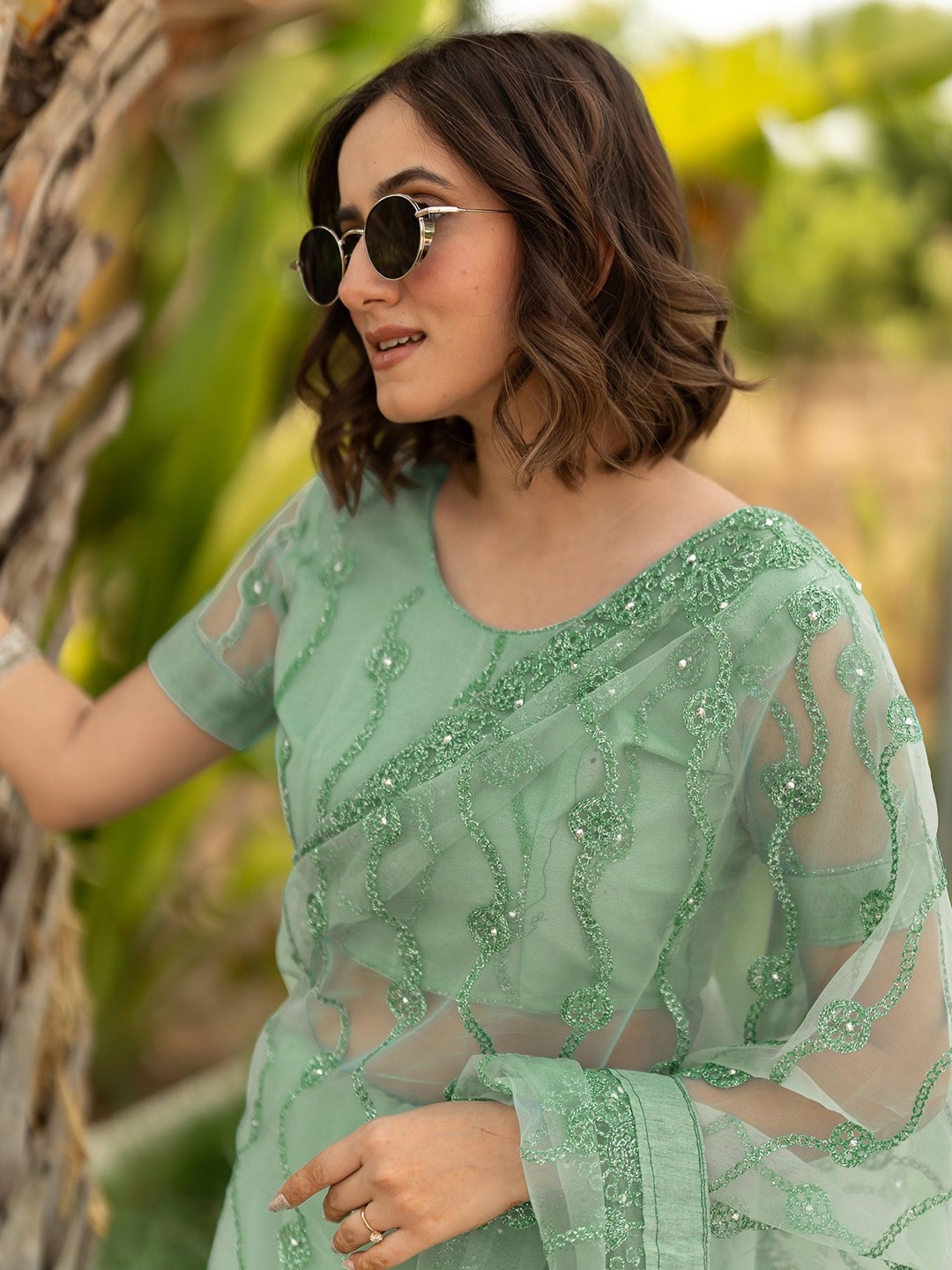

Subham Women Embellished Beads and Stones Net Saree, Green