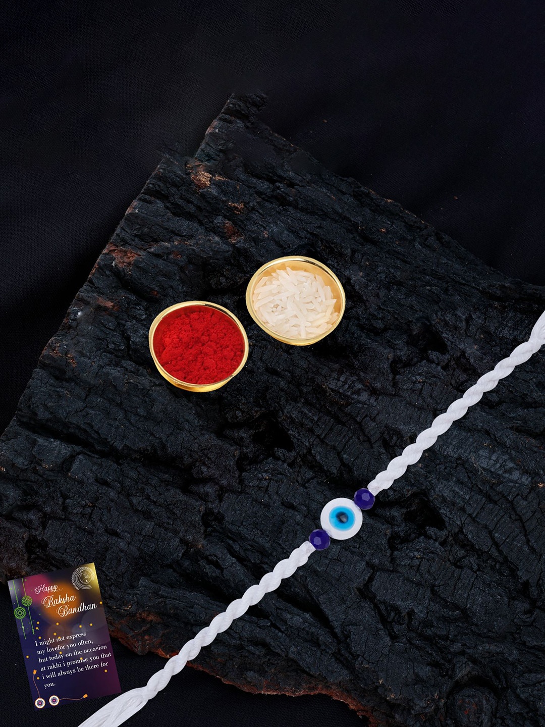 

Silver Shine Set Of 2 Evil Eye Beaded Thread Rakhis with Greeting Card & Roli Chawal, Gold