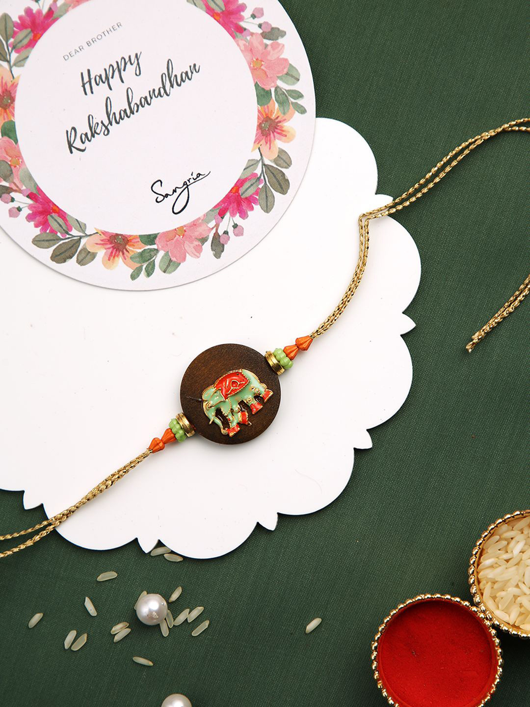 

Sangria Resin Elephant Embossed Royal Rakhi Greeting Card & Roli Chawal, Beige