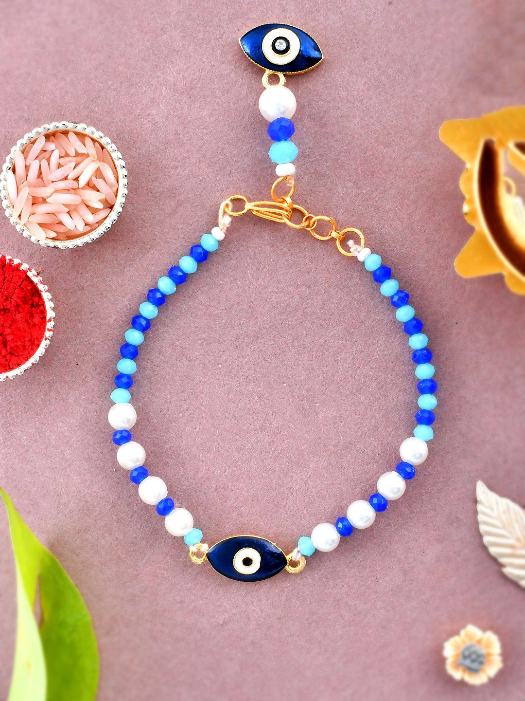 

Sangria Enameled Evil Eye Wraparound Bracelet Rakhi With Roli Chawal & Greeting Card, Blue