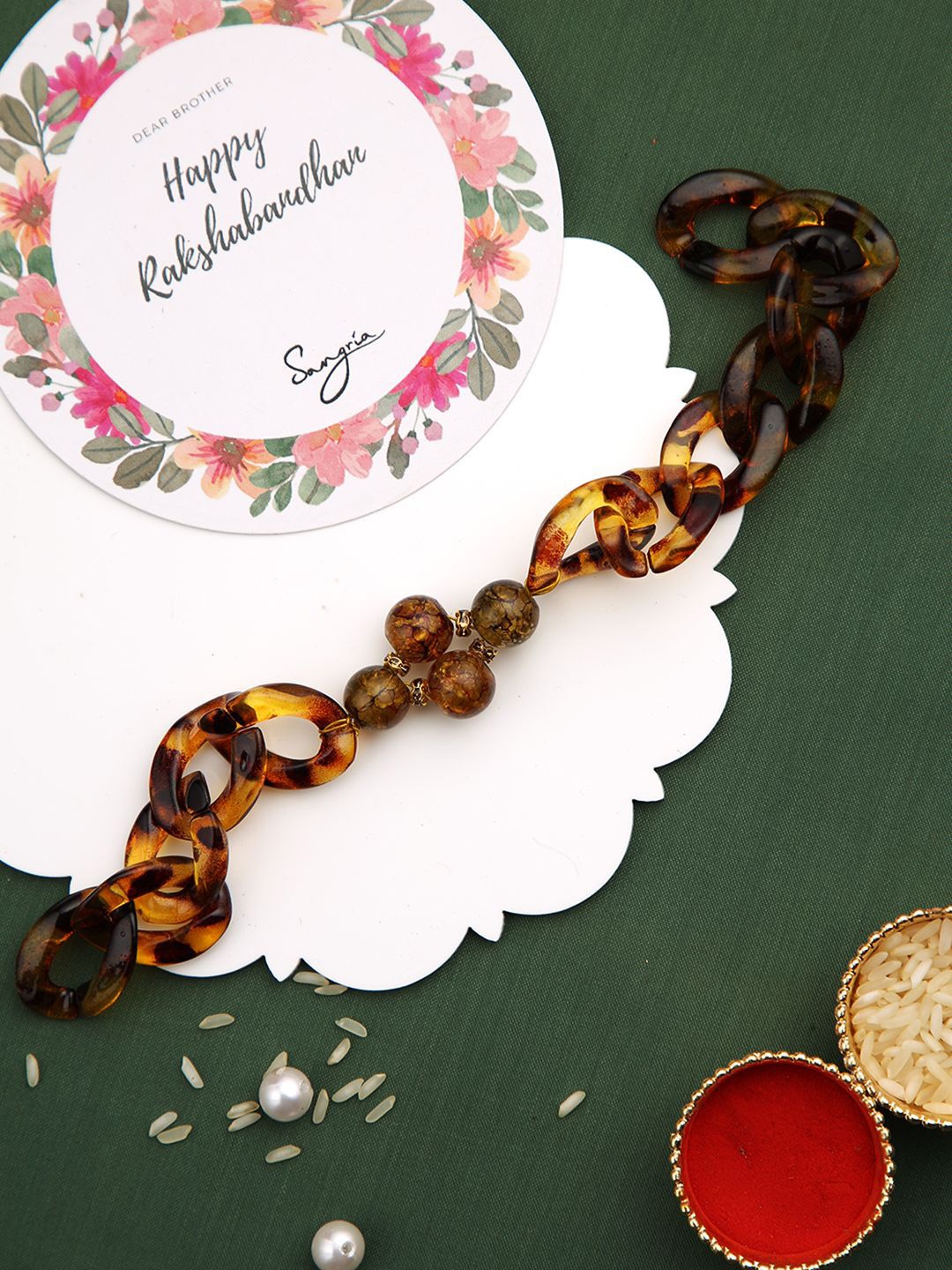 

Sangria Crystal-Studded Bracelet Rakhi With Greeting Card & Roli Chawal, Brown
