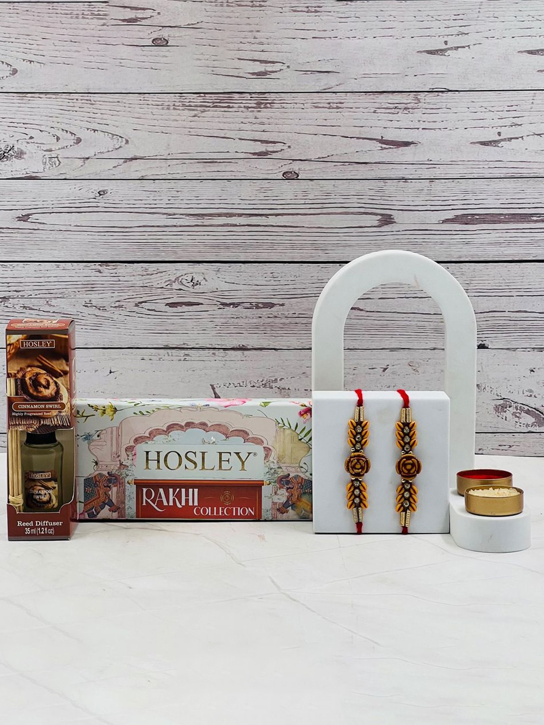 

HOSLEY Set Of 2 Rakhi With Cinnamon Swirl Reed Diffuser & Roli & Chawal Rakhi Gift Set, Gold