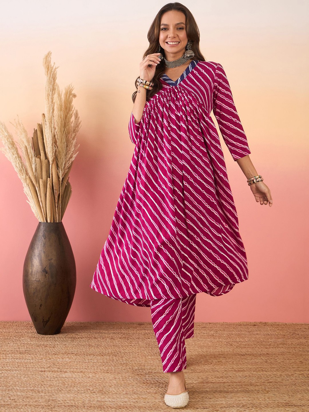 

InWeave V Neck Leheriya Printed Regular Kurta with Trousers, Purple