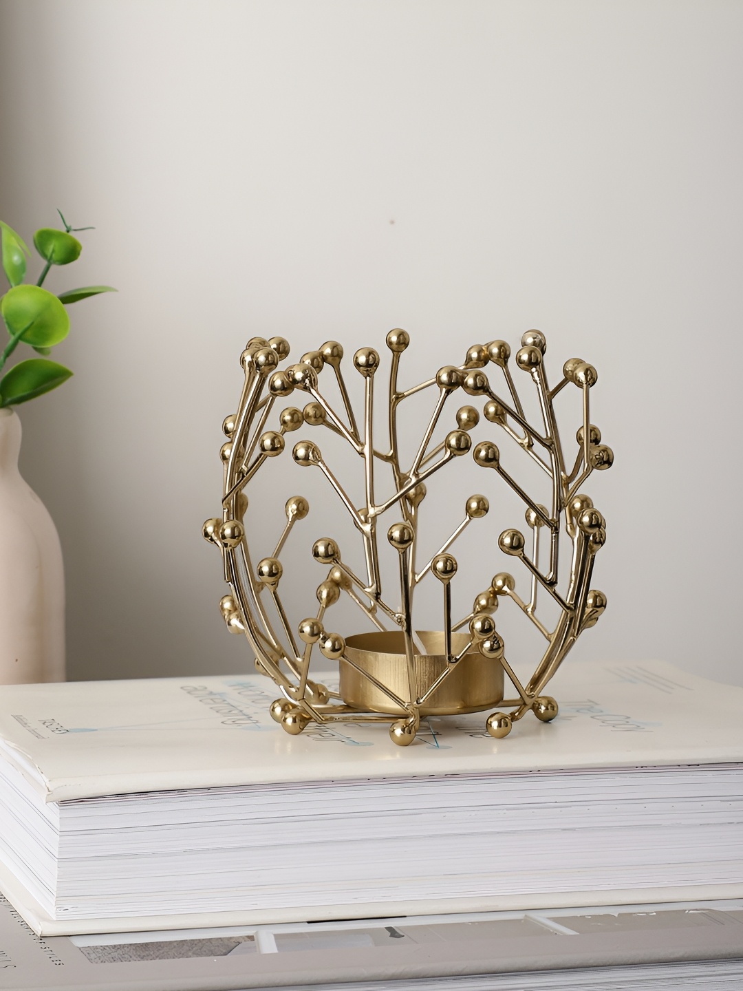 

Decor de Maison Juanita Gold Toned Aluminium Candle Holder