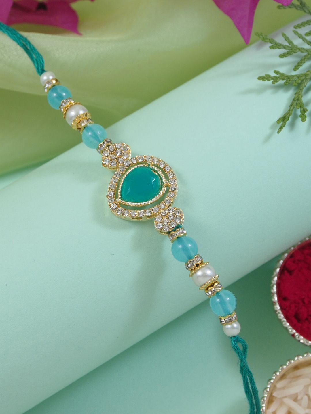 

I Jewels Kundan Studded Pearl Beaded Thread Rakhi With Roli Chawal & Rakshabandhan Card, Turquoise blue