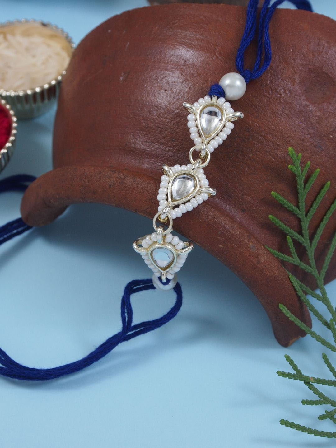 

I Jewels Kundan Studded Pearl Beaded Thread Rakhi With Roli Chawal & Rakshabandhan Card, Blue