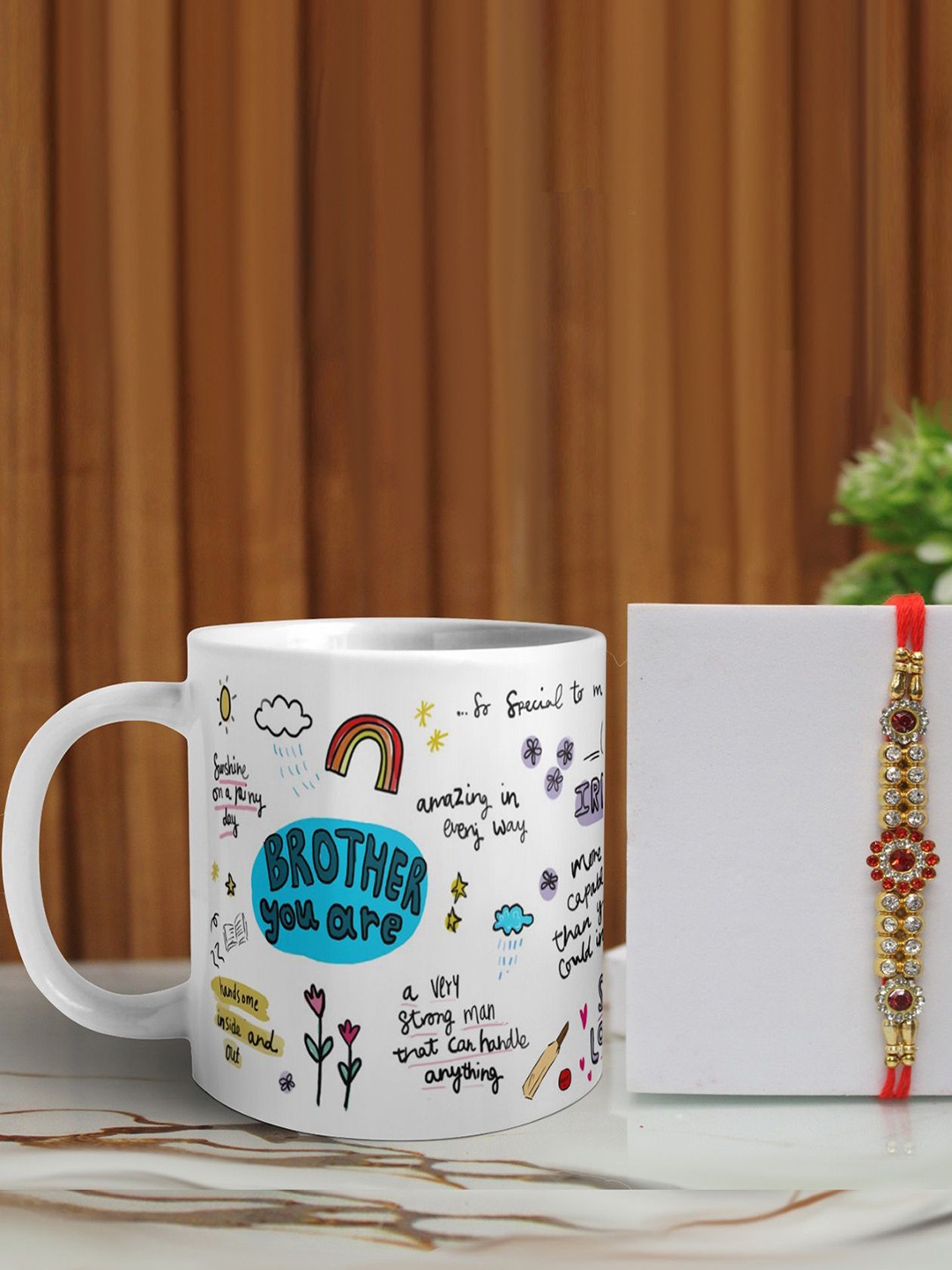 

Phirki Studio Set of 2 Stone Studded Thread Rakhi With Mugs & Roli Chawal, Red
