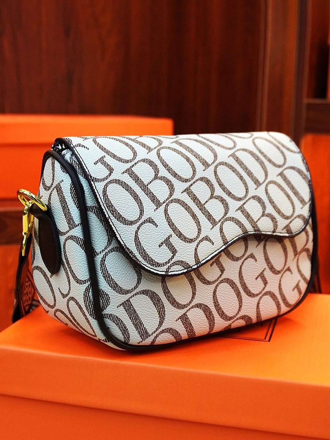 

Diva Dale Textured PU Structured Sling Bag with Tasselled, White