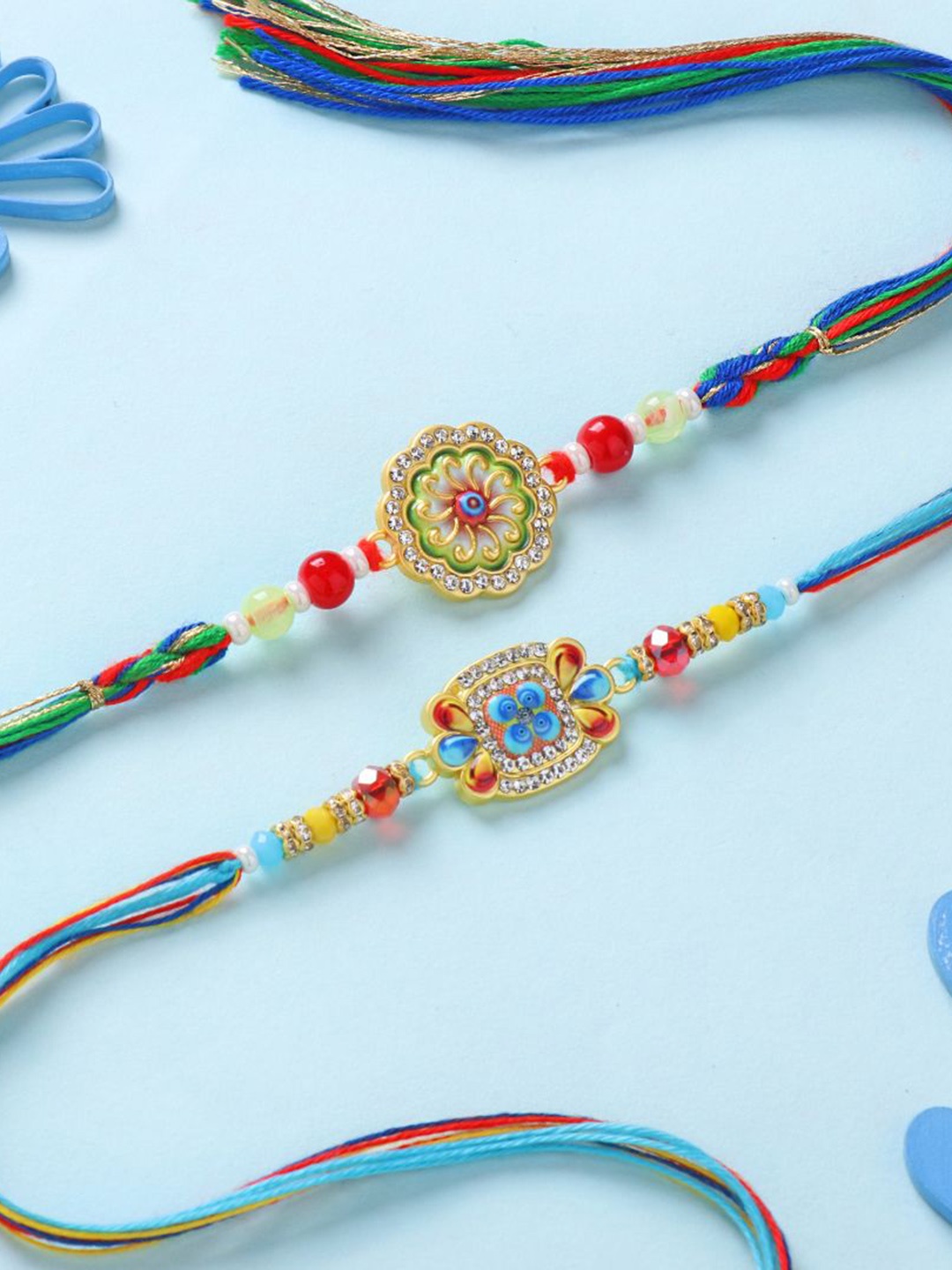 

Floweraura Set of 2 Intricate Stone Meenakari Thread Rakhis with Roli Chawal, Blue