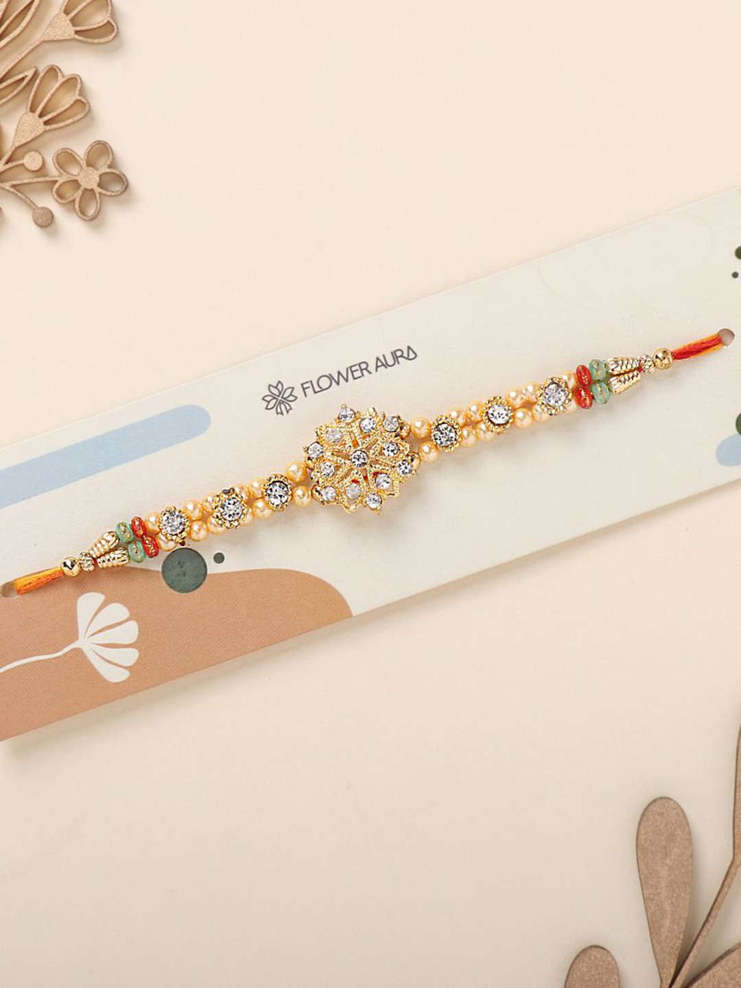 

Floweraura Stunning Stone Thread Bracelet Rakhi with Roli Chawal, Gold