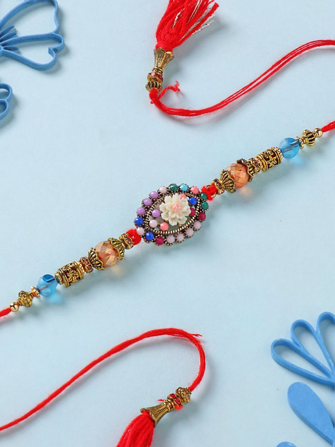 

Floweraura Vibrant Beadwork Designer Thread Bracelet Rakhi with Roli Chawal, Red