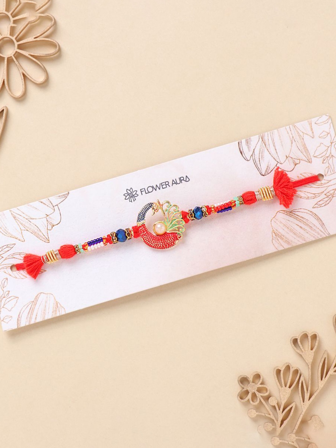 

Floweraura Designer Peacock Charm Bracelet Thread Rakhi with Roli Chawal, Gold