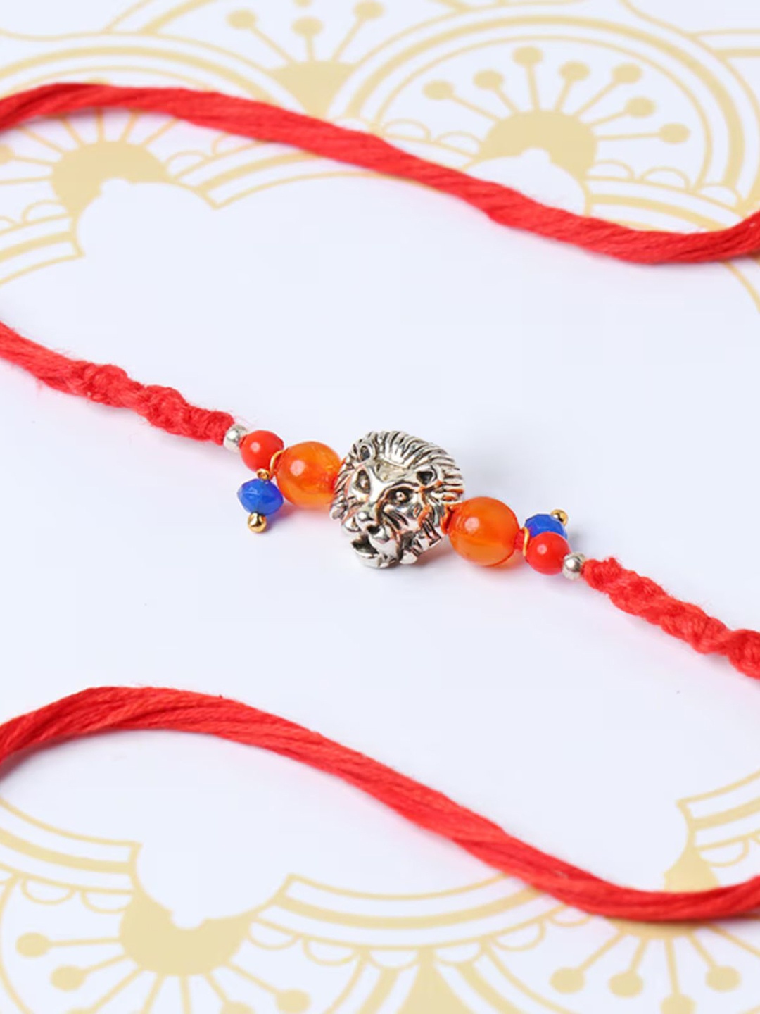 

Floweraura Royal Lion Head Beaded Rakhi Bracelet With Roli Chawal, Gold
