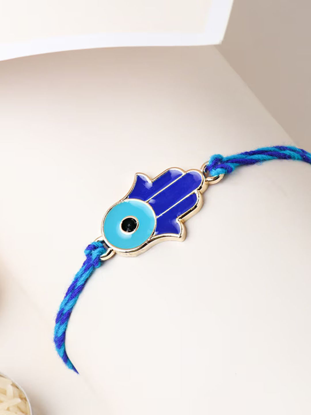 

Floweraura Hamsa Charm Stone Studded & Beaded Thread Rakhi With Roli Chawal, Gold