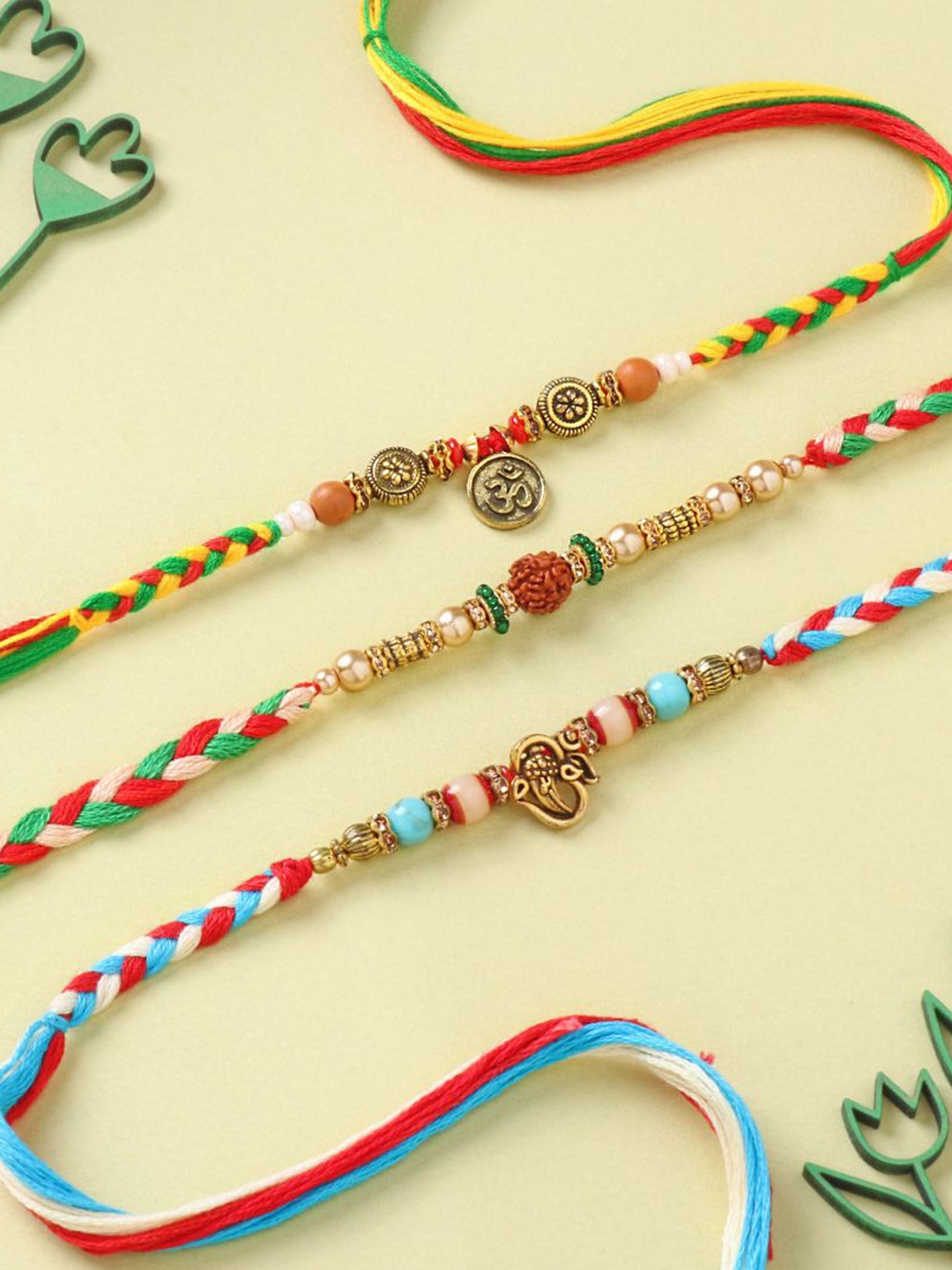 

Floweraura Set Of 3 Stone Studded & Beaded Thread Rakhis With Roli Chawal, Blue