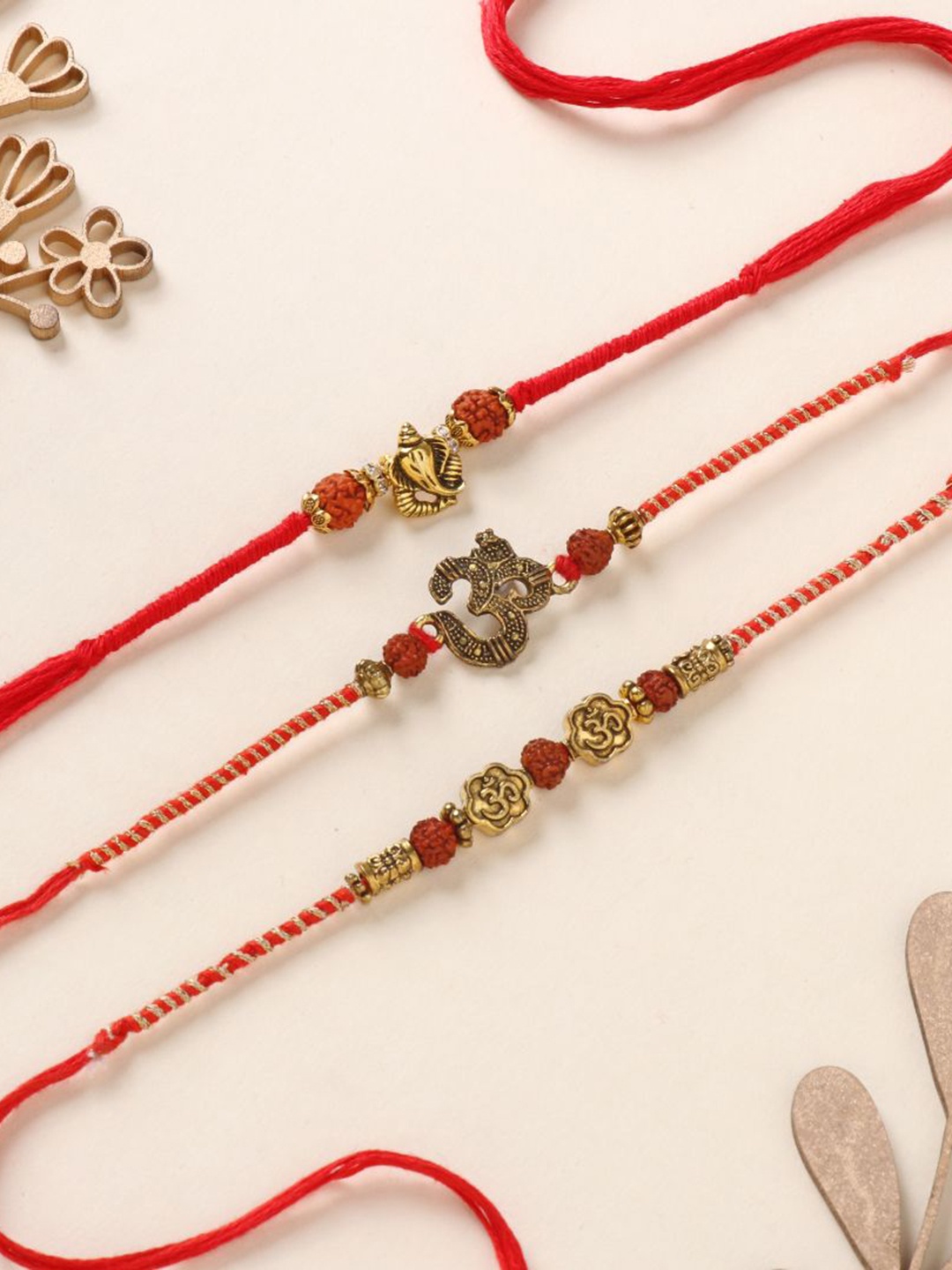 

Floweraura Set of 3 Om Ganesha Thread Bracelet Rakhis with Roli Chawal, Gold