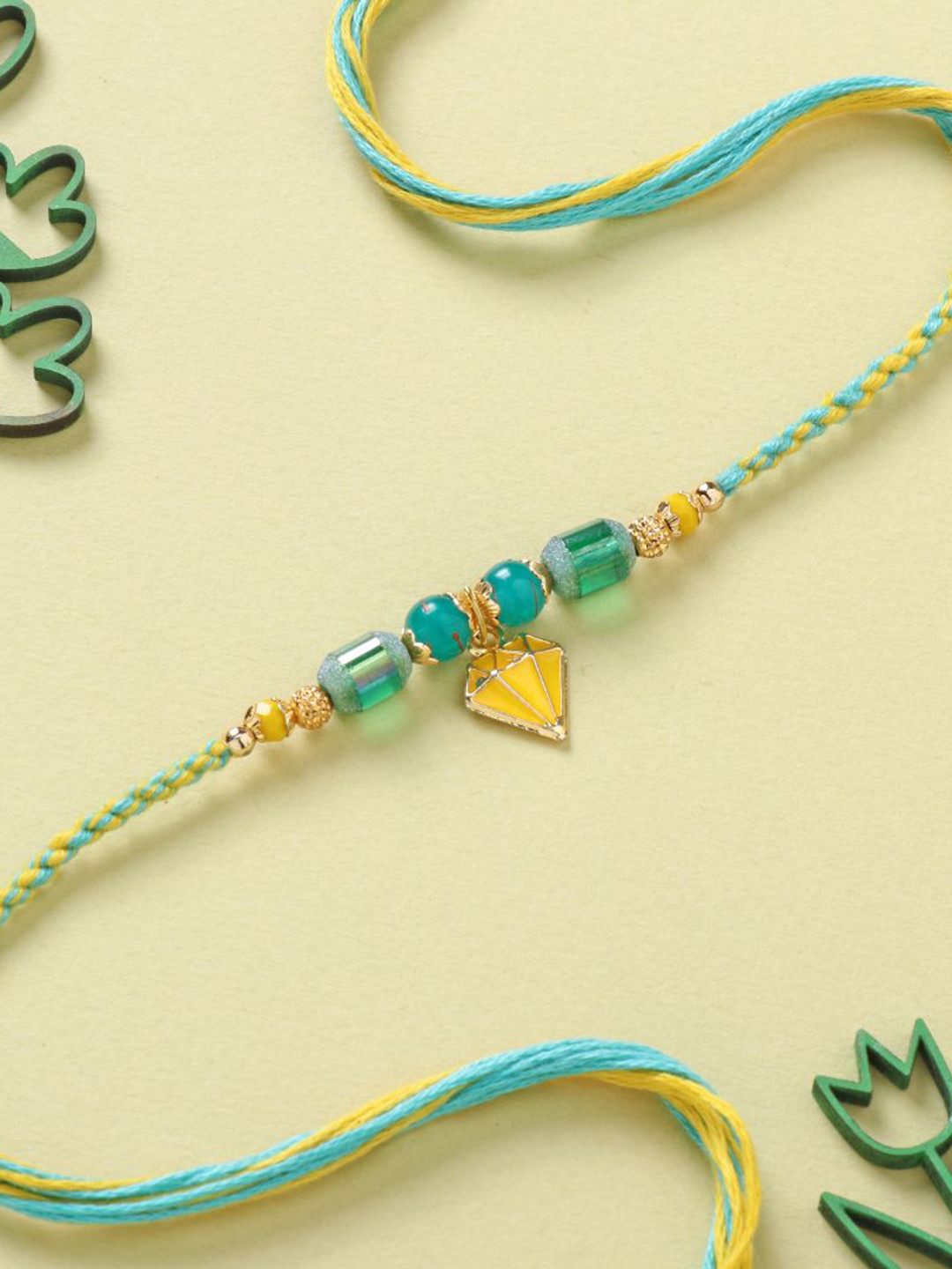 

Floweraura Trendy Metal Beaded Thread Rakhi with Roli Chawal, Green