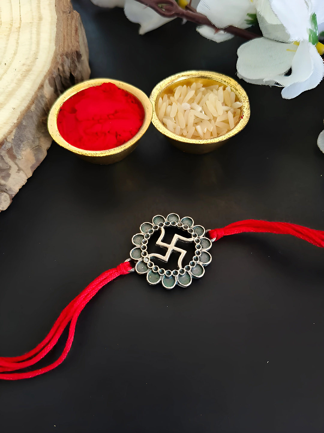 

Sangria Silver Plated Swastika Thread Rakhi & Roli Chawal, Red