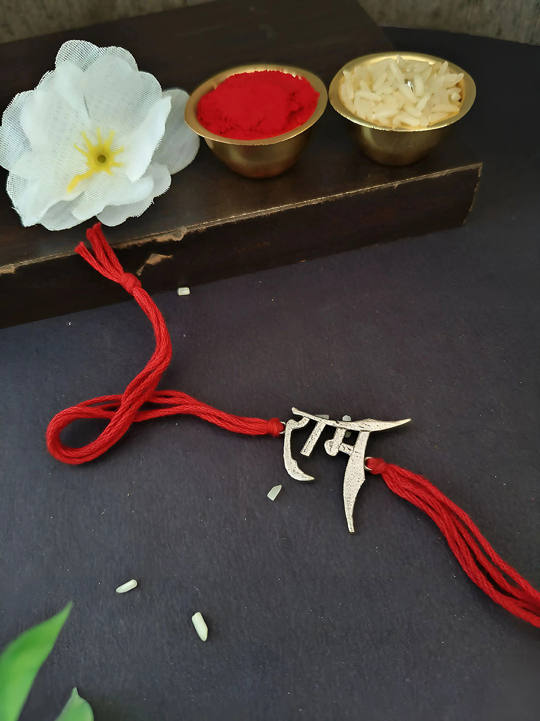 

Sangria Silver Plated Ram Charm Thread Rakhi With Roli Chawal, Red