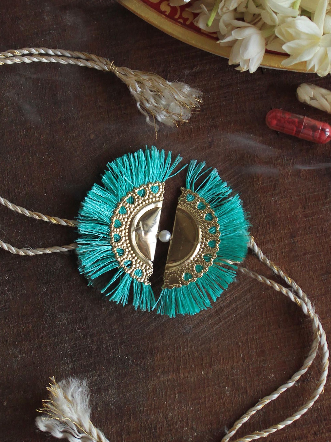 

BeAbhika Aqua Tassel Thread Rakhi With Roli Chawal, Gold