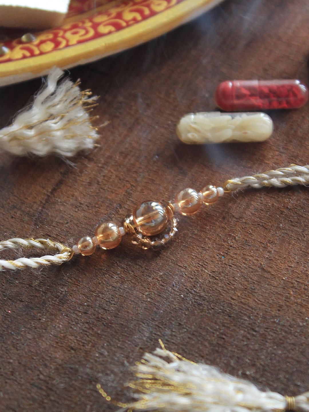 

BeAbhika Beaded Thread Rakhi with Roli Chawal, Gold