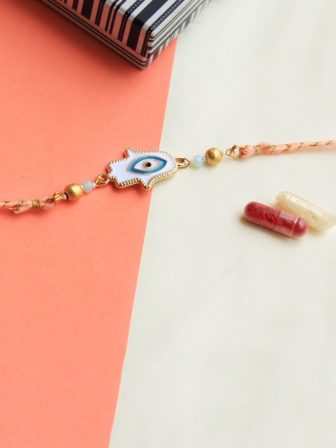 

BeAbhika Hamsa Evil Eye Beaded Thread Rakhi With Roli Chawal Vegan Capsules, White