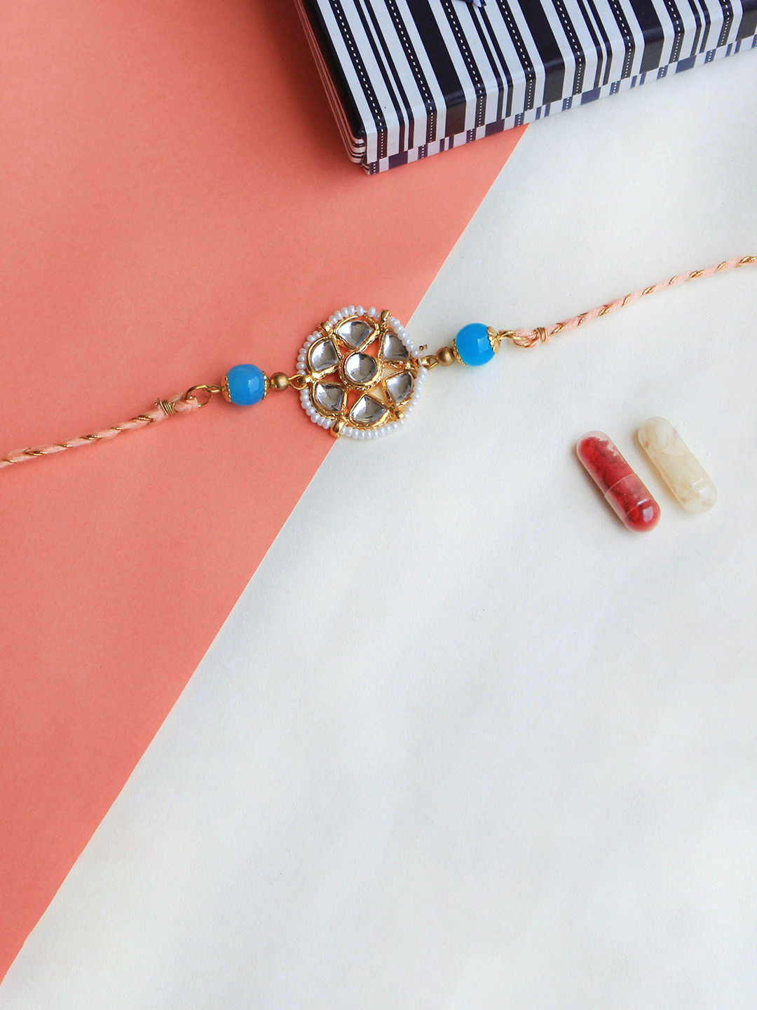 

BeAbhika Floral Kundan Thread Rakhi With Roli Chawal, Gold