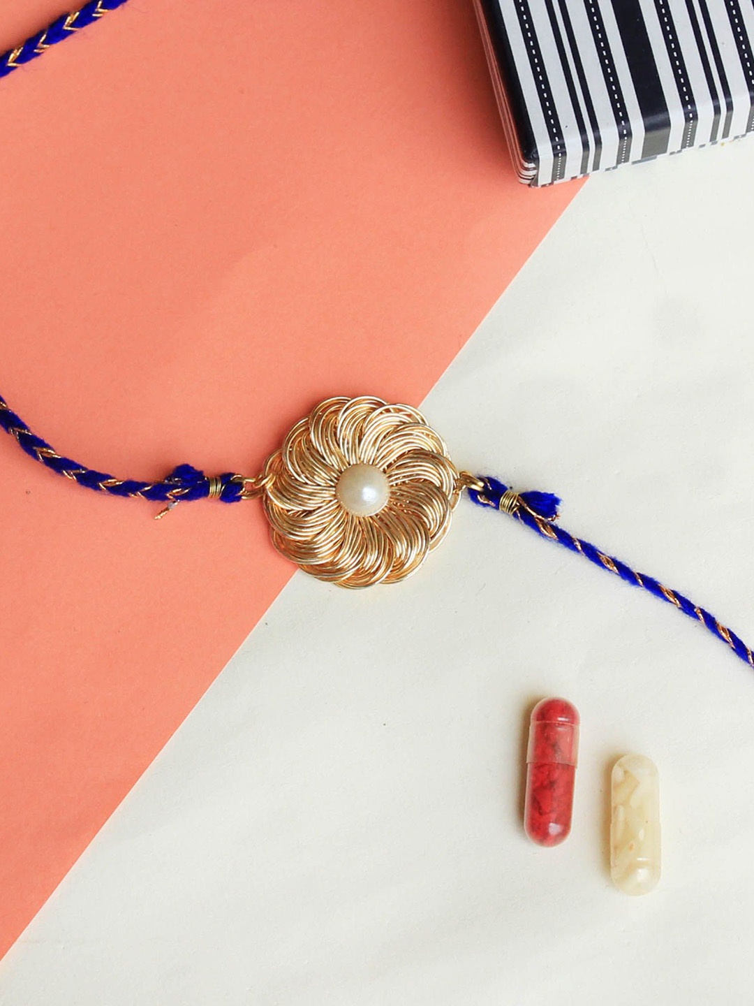 

BeAbhika Floral Charm Thread Rakhi With Roli Chawal, Gold