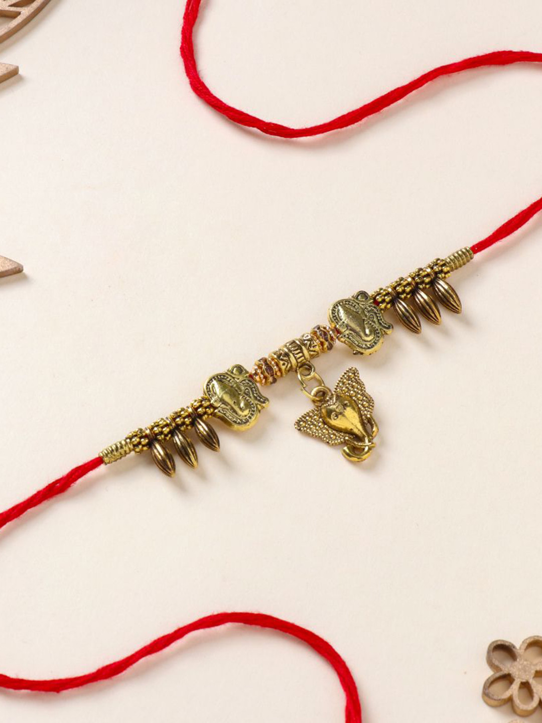

Floweraura Ganesha Charm Beaded Thread Rakhi With Roli Chawal, Gold