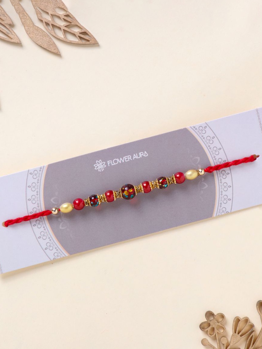 

Floweraura Elegant Beaded Rakhi Bracelet With Roli Chawal, Gold
