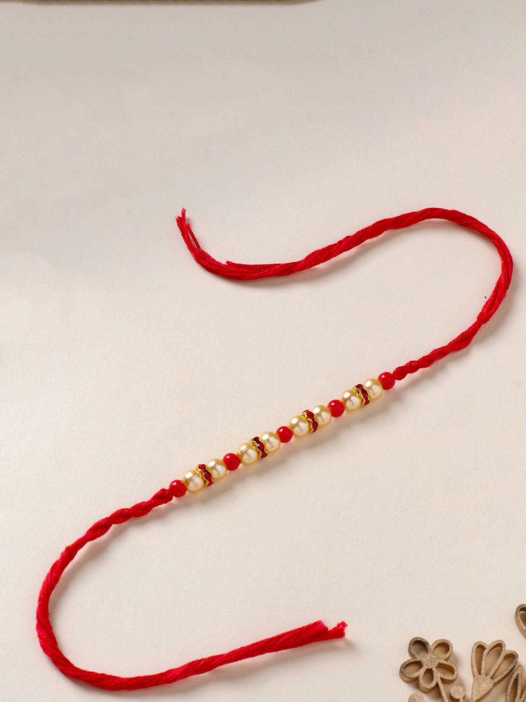 

Floweraura Pearl Thread Thread Bracelet Rakhi with Roli Chawal, Gold