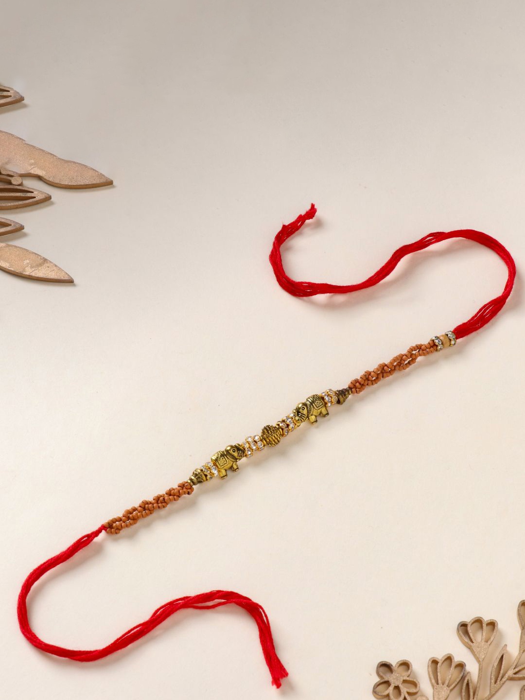 

Floweraura Stone Studded & Beaded Thread Rakhi With Roli Chawal, Gold