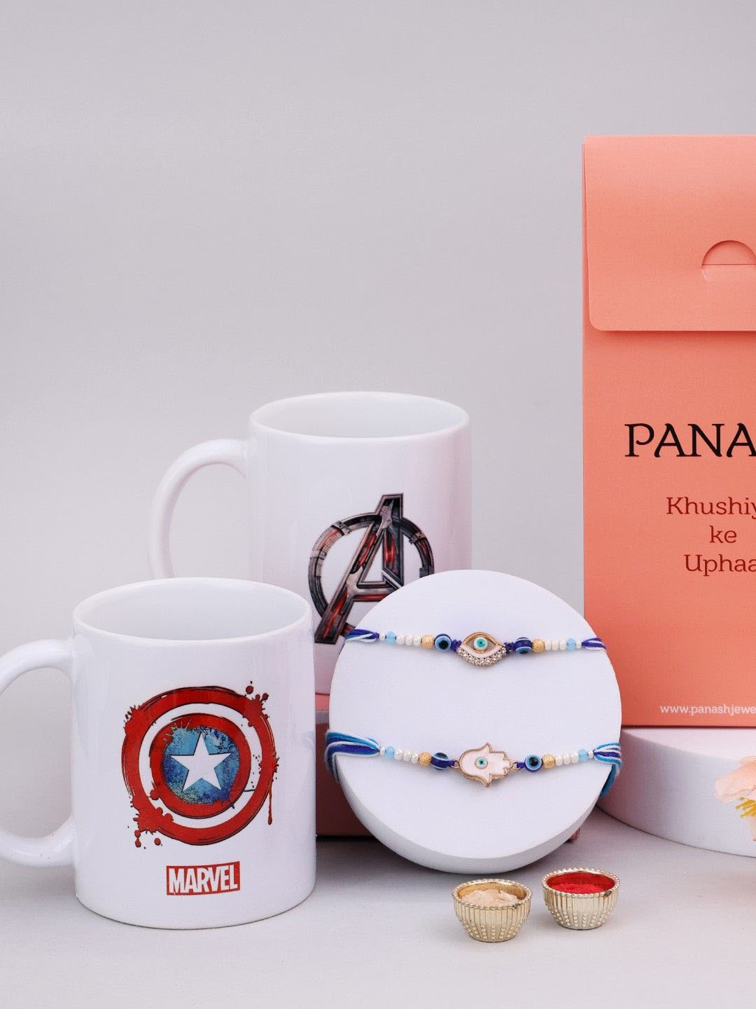 

PANASH Set Of 2 Stone-Studded & Beaded Rakhi With Roli Rice & Mugs, Red