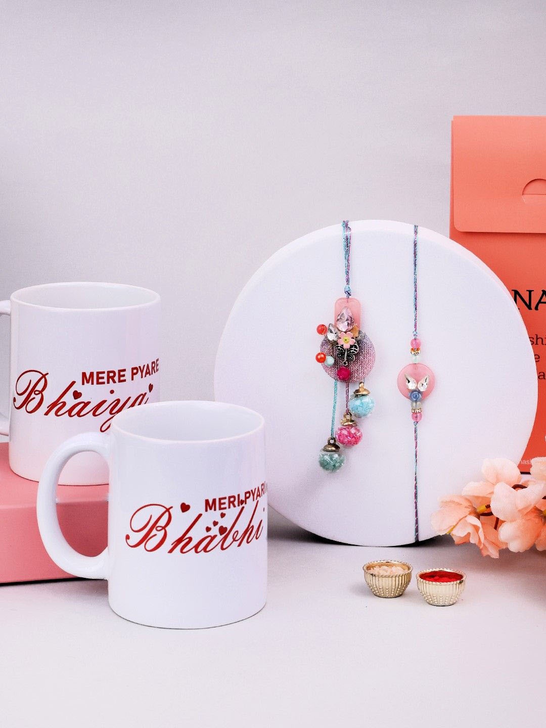 

PANASH 2 Pcs Rakhi With Mugs & Roli Chawal Set, Gold