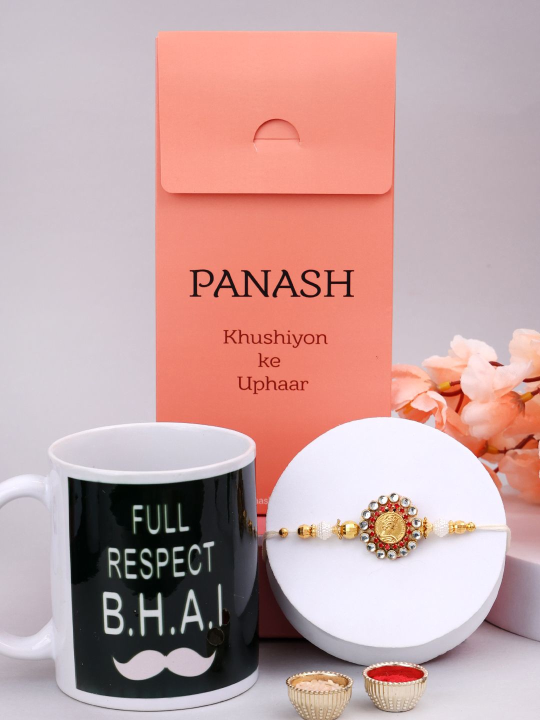 

PANASH Set Of 2 Beaded Rakhis With Mugs And Roli Chawal, Gold