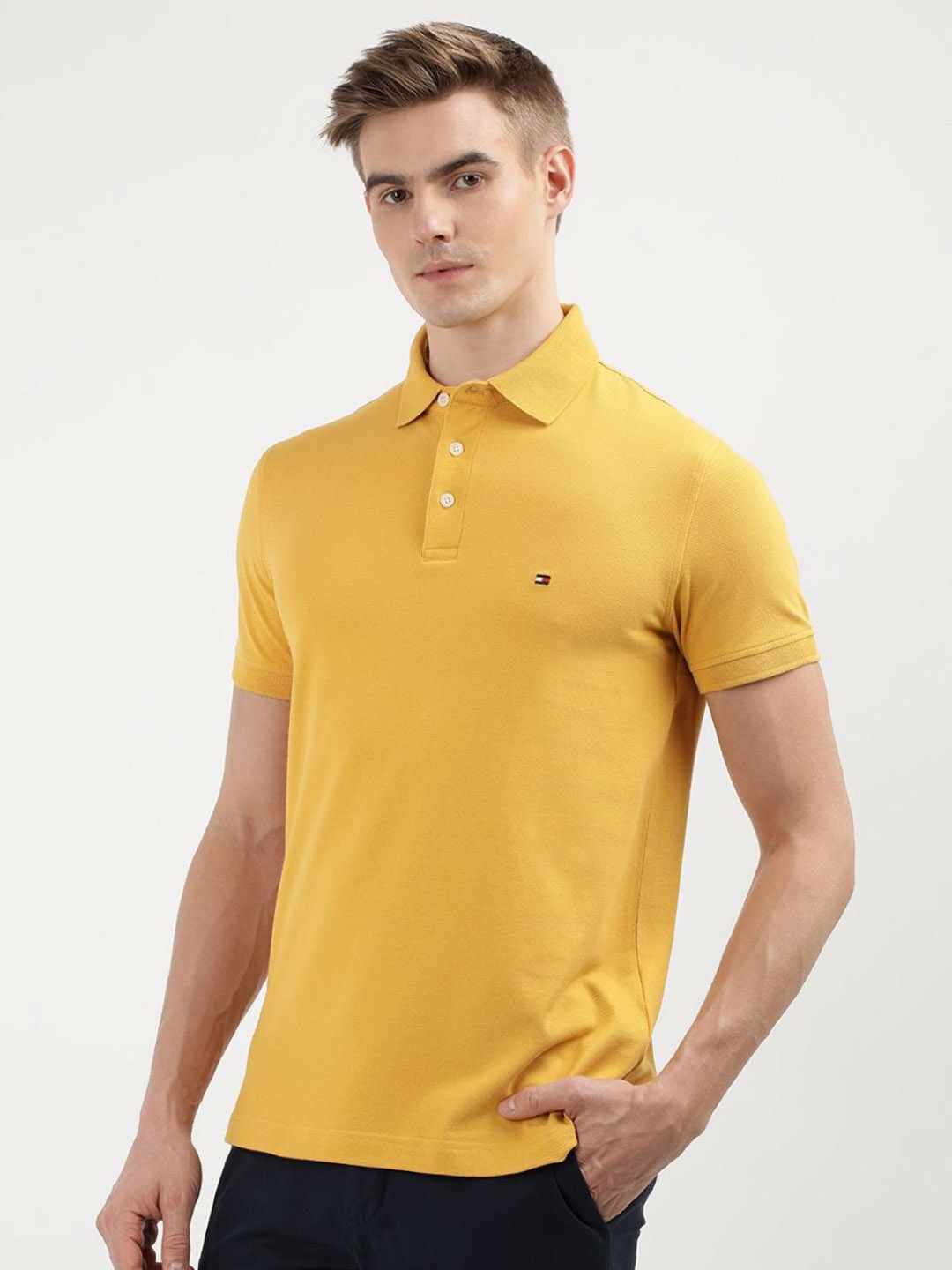

Tommy Hilfiger Men Solid Polo Collar Cotton Slim Fit T-Shirt, Yellow