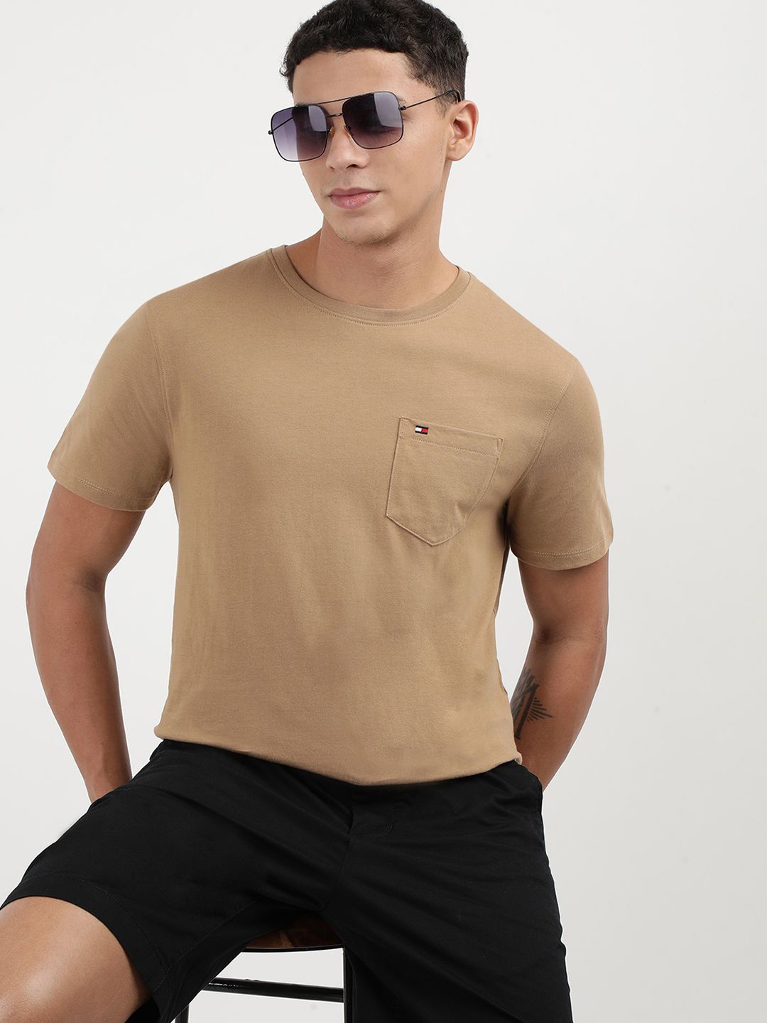 

Tommy Hilfiger Men Solid Round Neck Cotton T-Shirt, Beige